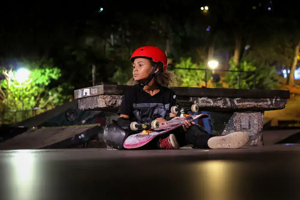 Skateboards and helmets displayed at the rental desk